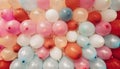 Background of colored balloons in pale tones.