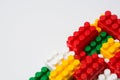 Background from colored cubes of details of blocks of a child`s constructor isolated on a white background with copy space Royalty Free Stock Photo
