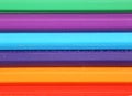 Background of colored pencils, which lie horizontally