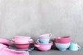 Background with colorful crockery, on the grey table against tex Royalty Free Stock Photo