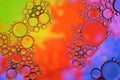 Background of colorful oil drops in water surface. Royalty Free Stock Photo