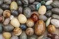 Background of colorful onyx stone eggs of different colors on a Royalty Free Stock Photo