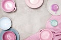 Background with colorful pastel crockery on the light grey table Royalty Free Stock Photo