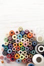 Background of colorful sewing threads on white table Royalty Free Stock Photo