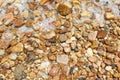 Background colorful wet stones on beach with water Royalty Free Stock Photo