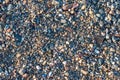Background: colourful coastline pebbles of different sizes