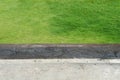 background concept, focus on the edge of concrete ground with green grass Royalty Free Stock Photo