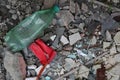 A background of constraction debris and a plastic bottle Royalty Free Stock Photo