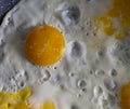 Background with cooked food. Appetizing scrambled eggs with a round yolk. Royalty Free Stock Photo