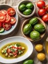 Background of cooking ingredients. Olive oil and fresh vegetables and fruits on a wooden table Royalty Free Stock Photo