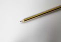 White blank paper with one isolated retro black and yellow lead pencil Royalty Free Stock Photo