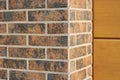The background is a corner of a freshly laid clean brick wall in a new building texture