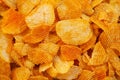 Background corrugated golden chips with texture. Food texture. potato chips.Top view. Mock up. Copy space.Template. Blank.