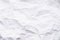 Background of crumpled paper. Close-up of a sheet of white, crumpled, uneven paper. Abstract texture background, copy space Royalty Free Stock Photo