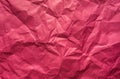Background. Crumpled pink sheet of paper