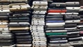 Background of damaged mobile phones. A bunch of broken smartphones. Used phones stacked on top of each other. Repair services and Royalty Free Stock Photo