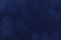 Background of dark blue suede fabric closeup. Velvet matt texture of navy blue nubuck textile Royalty Free Stock Photo