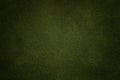 Background of dark green suede fabric closeup. Velvet matt texture of olive nubuck textile Royalty Free Stock Photo