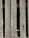 background of dark old wooden slats with holes and screws spaced apart Royalty Free Stock Photo