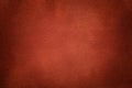 Background of dark orange suede fabric closeup. Velvet matt texture of ginger nubuck textile Royalty Free Stock Photo