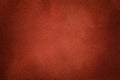 Background of dark orange suede fabric closeup. Velvet matt texture of ginger nubuck textile Royalty Free Stock Photo