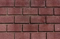 Background of dark red brick removed by sunny day frontal Royalty Free Stock Photo