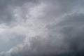 Background with dark thunderclouds in front of lightning and heavy rain. The sky is completely covered by clouds Royalty Free Stock Photo