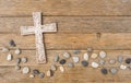 Cross background with wave of stones on wood Royalty Free Stock Photo