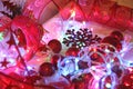 Colorful Christmas and new year background is decorated with lights of garlands, sparkling red balls, snowflake and decorative