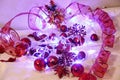 Christmas and Valentin background is decorated with lights of garlands, sparkling red balls, snowflake and decorative
