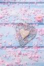 Background with decorative heart and petals of sakura flowers Royalty Free Stock Photo