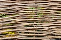 Background of decorative rustic village wicker fence