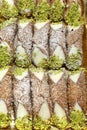 Background of delicious Sicilian cannoli with grated pistachios