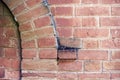 Detail of apparent brick wall with closeup of an arc