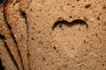 Background, detail and close-up shot of a few slices of German wholemeal bread, one on top of the other. A hole was cut in the Royalty Free Stock Photo