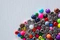 Background from different colored beads with numbers and symbols Royalty Free Stock Photo