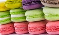 Background of different colors from a delicious dessert macaron, like a wall
