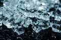 Background with different crushed ice cubes on black reflection table with water drops Royalty Free Stock Photo