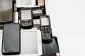 Background of dirty, broken, tablets and old smartphones