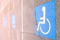 The background of disabled parking permit sign painted on the street, also known as the pavement of handicap with wheelchair