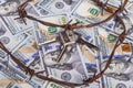 the background of dollars on it is barbed wire. close-up Royalty Free Stock Photo