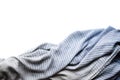 Background with draped blue gray cotton fabric, napkin, striped tablecloth or scarf on white surface