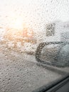 Background from drops of water and rain on a car glass window on a cloudy autumn day. Calmness, freshness, weather Royalty Free Stock Photo