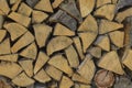 Background of dry chopped firewood laid in a woodpile. Close-up Royalty Free Stock Photo