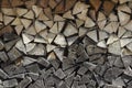 Background of dry chopped firewood laid in a woodpile. Close-up Royalty Free Stock Photo