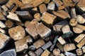 Background of dry chopped firewood logs. Pile of wooden logs. Wall of stacked wood logs. Neatly stacked firewood logs Royalty Free Stock Photo