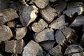 Background of dry chopped firewood logs. Pile of wooden logs. Wall of stacked wood logs. Neatly stacked firewood logs Royalty Free Stock Photo