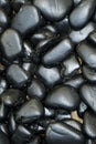 Background Each stone in the background bears the marks of time and natural processes.of black stones. Royalty Free Stock Photo