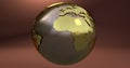 A background with the Earth planet made in gold, which shows the Africa continent. Royalty Free Stock Photo