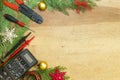 Electrician tools and instruments and Christmas decorations on wooden background